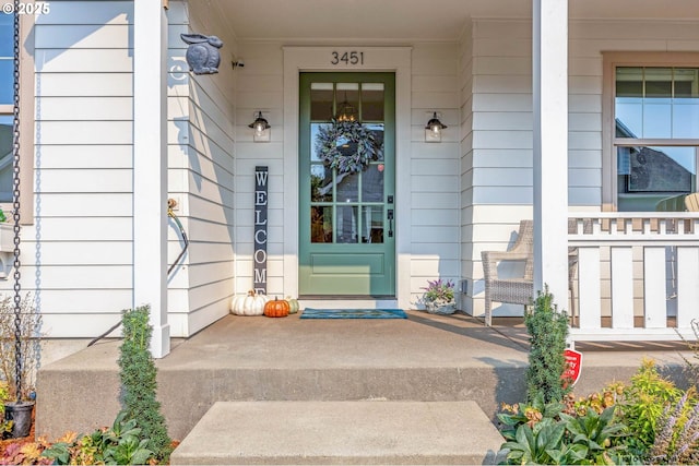 doorway to property with a porch
