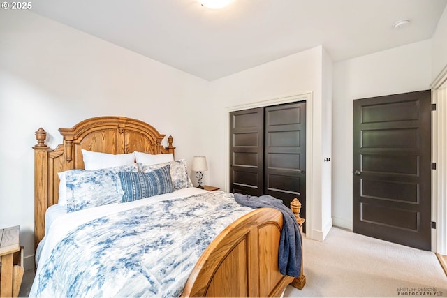 bedroom featuring baseboards and light colored carpet