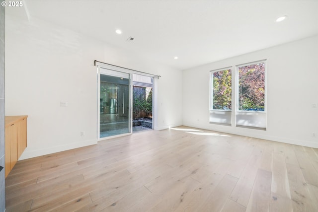 2585 SE 13th Ave, Portland, OR 97202 - spare room featuring baseboards, light wood-style floors, and recessed lighting
