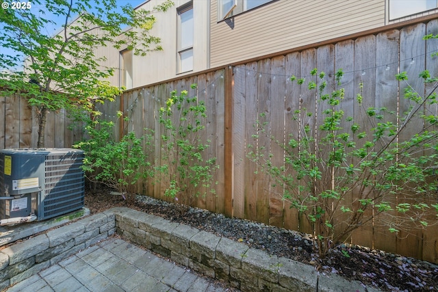 2585 SE 13th Ave, Portland, OR 97202 - view of patio featuring central AC unit and fence