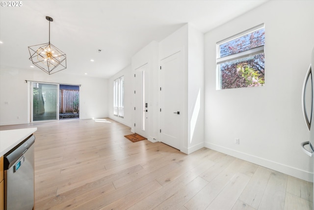 2585 SE 13th Ave, Portland, OR 97202 - interior space with a chandelier, a wealth of natural light, recessed lighting, and appliances with stainless steel finishes