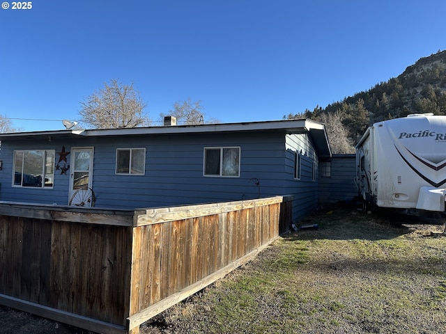 view of side of property with a mountain view