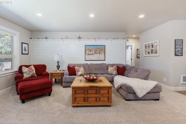 living area featuring carpet floors, baseboards, and recessed lighting