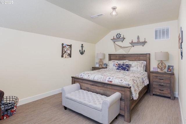 bedroom with lofted ceiling, baseboards, and visible vents