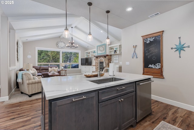 kitchen with dark wood finished floors, visible vents, lofted ceiling with beams, stainless steel dishwasher, and a sink