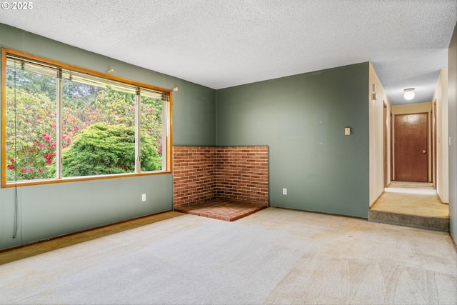 unfurnished living room featuring a textured ceiling and carpet