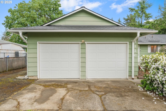 garage featuring fence