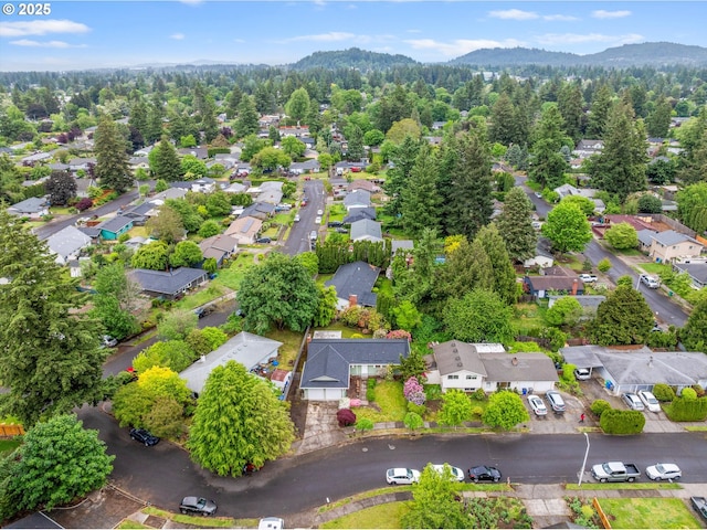 aerial perspective of suburban area with a mountainous background