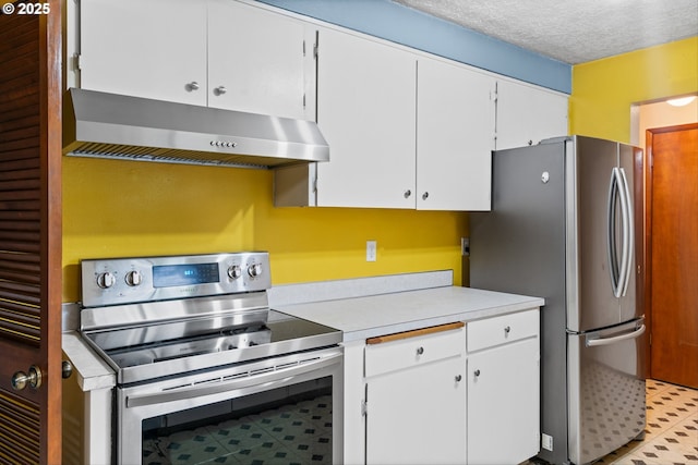 kitchen featuring appliances with stainless steel finishes, under cabinet range hood, light countertops, white cabinetry, and light flooring