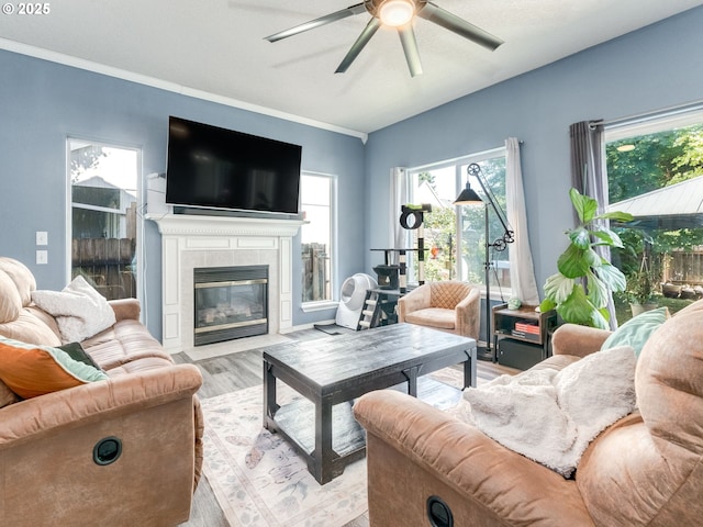 35530 Edies Way, Saint Helens, OR 97051 - living area with a ceiling fan, light wood-style flooring, a tile fireplace, and ornamental molding