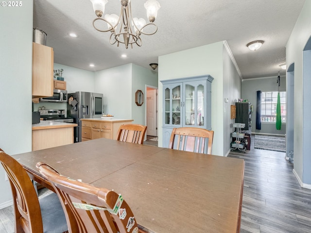 35530 Edies Way, Saint Helens, OR 97051 - dining area with a chandelier, wood finished floors, ornamental molding, a textured ceiling, and recessed lighting