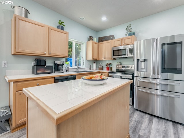 35530 Edies Way, Saint Helens, OR 97051 - kitchen featuring stainless steel appliances, tile countertops, light brown cabinets, light wood-style floors, and recessed lighting