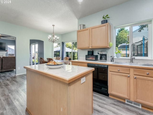 35530 Edies Way, Saint Helens, OR 97051 - kitchen with dishwasher, light brown cabinets, tile countertops, light wood-type flooring, and a chandelier