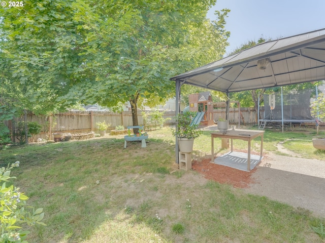 35530 Edies Way, Saint Helens, OR 97051 - fenced backyard with a trampoline, a playground, and a gazebo