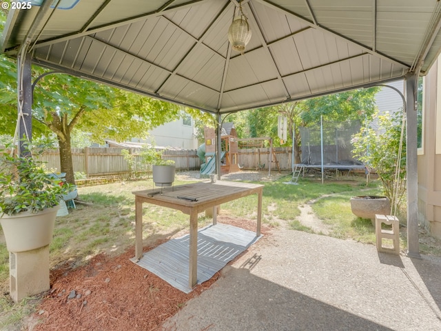 35530 Edies Way, Saint Helens, OR 97051 - fenced backyard with a trampoline, a playground, and a patio area