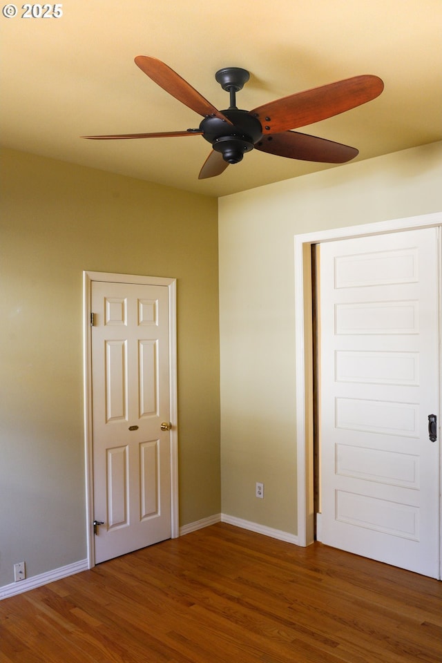74 NE Sacramento St, Portland, OR 97213 - unfurnished bedroom featuring wood finished floors, baseboards, and ceiling fan