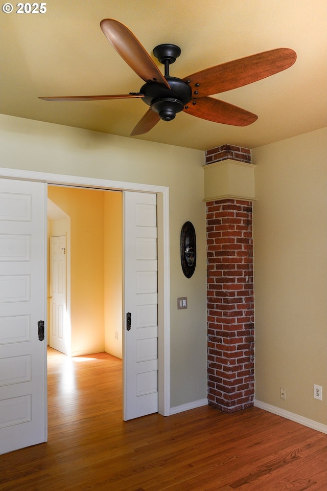 74 NE Sacramento St, Portland, OR 97213 - unfurnished room with ceiling fan, wood finished floors, and baseboards