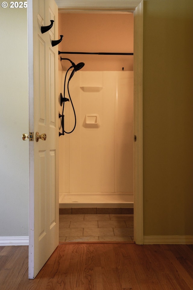 74 NE Sacramento St, Portland, OR 97213 - bathroom featuring wood finished floors, walk in shower, and baseboards