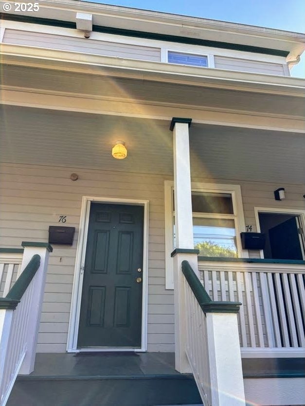 74 NE Sacramento St, Portland, OR 97213 - property entrance with a porch