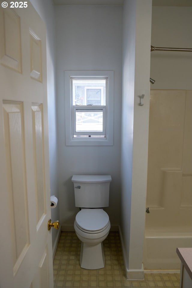 74 NE Sacramento St, Portland, OR 97213 - bathroom with toilet, baseboards, tile patterned floors, shower / washtub combination, and vanity