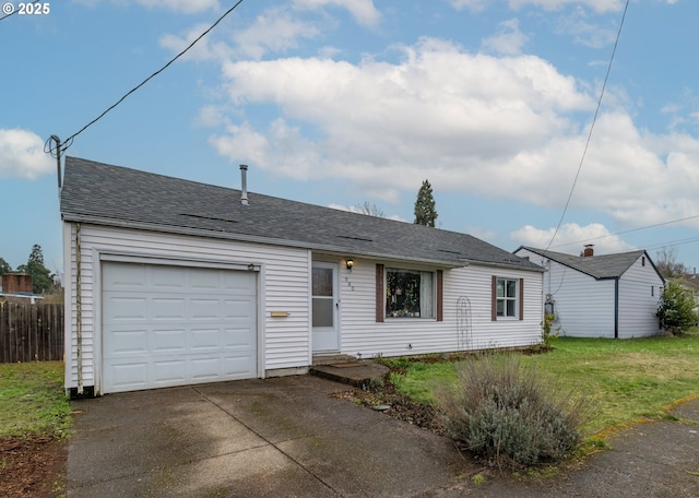 ranch-style home featuring concrete driveway, an attached garage, a front yard, and a shingled roof