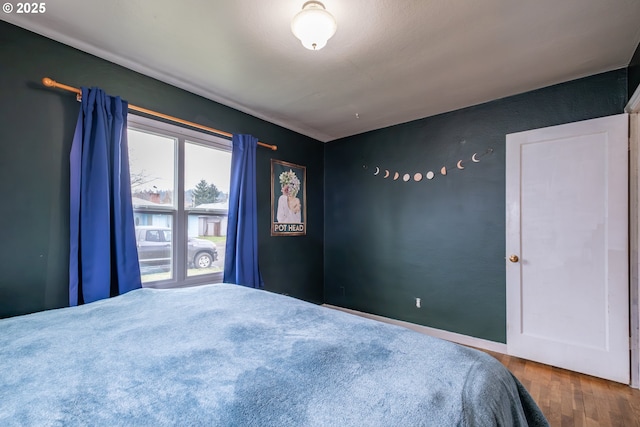 bedroom featuring wood finished floors