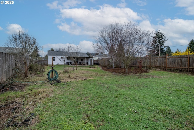 view of yard with a fenced backyard