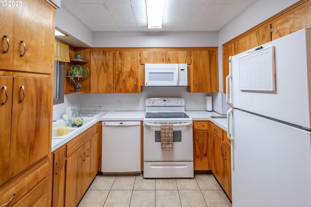 kitchen featuring white appliances, open shelves, light tile patterned flooring, a sink, and light countertops