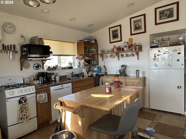 37102 Woods Ln, Richland, OR 97870 - kitchen with light tile patterned floors, white appliances, open shelves, vaulted ceiling, and a sink