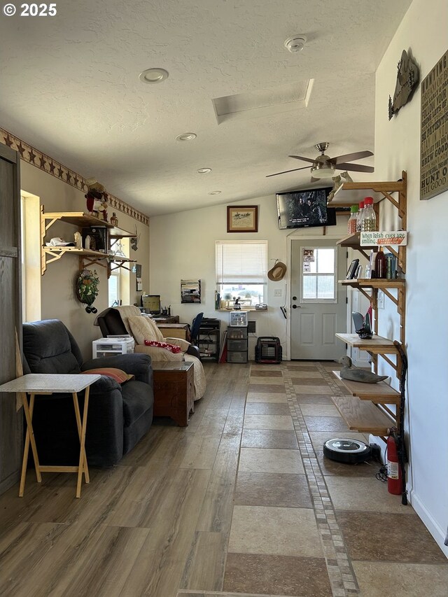 37102 Woods Ln, Richland, OR 97870 - living room featuring a textured ceiling, wood finished floors, a ceiling fan, and lofted ceiling