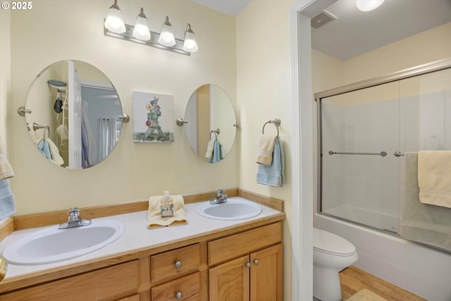 19774 SW Ashcroft Ln, Beaverton, OR 97003 - bathroom featuring double vanity, toilet, and shower / bath combination with glass door