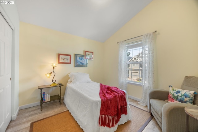 19774 SW Ashcroft Ln, Beaverton, OR 97003 - bedroom with baseboards, a closet, vaulted ceiling, and light wood-type flooring