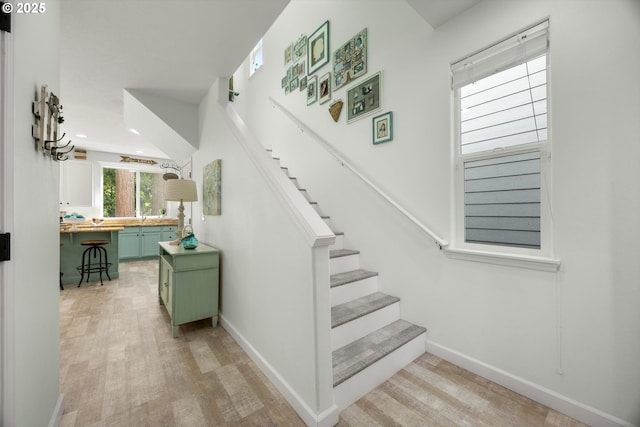 19774 SW Ashcroft Ln, Beaverton, OR 97003 - stairway featuring wood finished floors, baseboards, and recessed lighting
