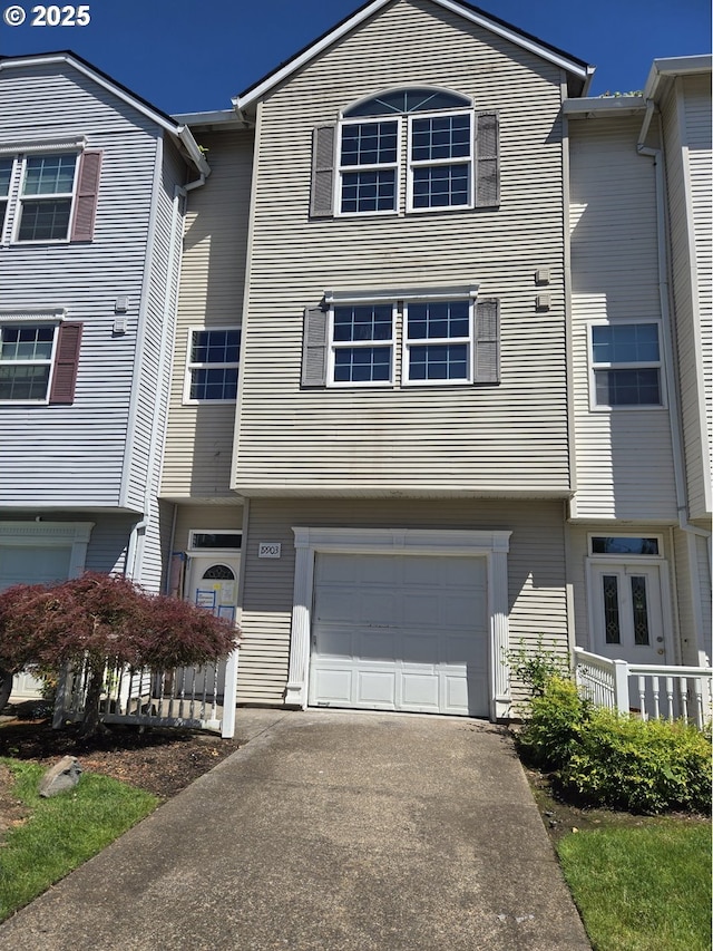 19903 SW Poplarwood Pl, Tualatin, OR 97062 - townhome / multi-family property with an attached garage and driveway