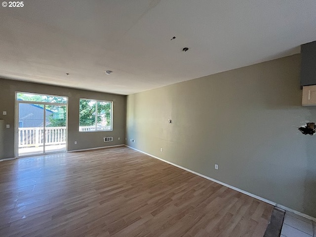 19903 SW Poplarwood Pl, Tualatin, OR 97062 - unfurnished room featuring wood finished floors and baseboards