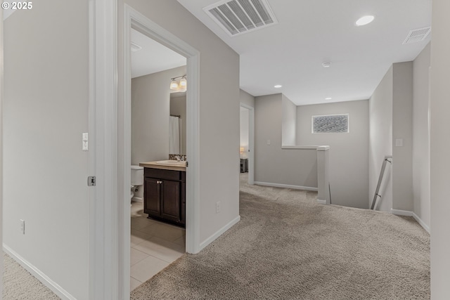 2908 S White Salmon Dr, Ridgefield, WA 98642 - hallway with an upstairs landing, light carpet, recessed lighting, and light tile patterned floors