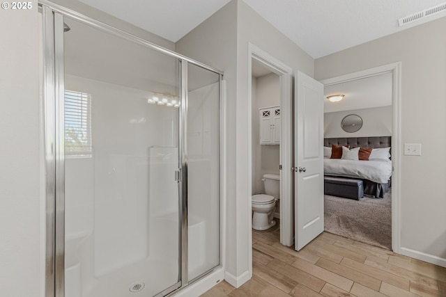 2908 S White Salmon Dr, Ridgefield, WA 98642 - ensuite bathroom with a shower stall and wood finished floors