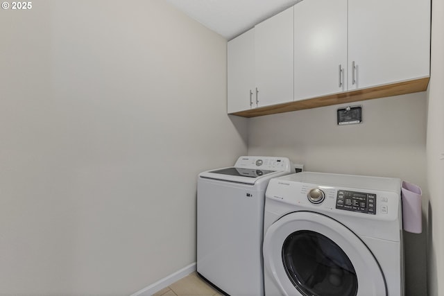 2908 S White Salmon Dr, Ridgefield, WA 98642 - laundry room featuring cabinet space, washing machine and dryer, and light tile patterned flooring
