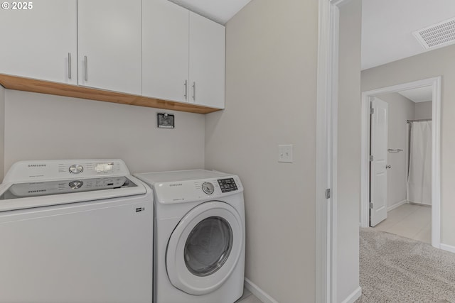 2908 S White Salmon Dr, Ridgefield, WA 98642 - washroom featuring cabinet space, washer and dryer, and light colored carpet