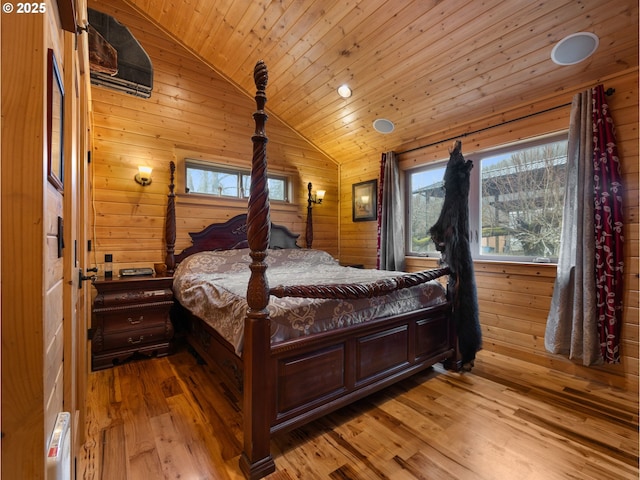 bedroom featuring wood ceiling, multiple windows, vaulted ceiling, and wood walls