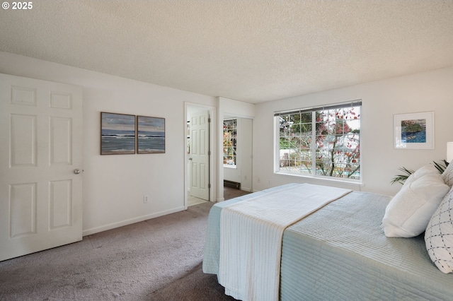 carpeted bedroom with a textured ceiling