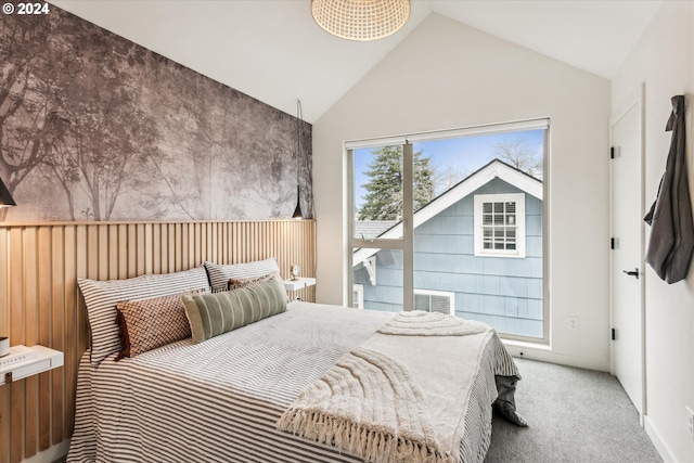 bedroom with lofted ceiling and carpet flooring