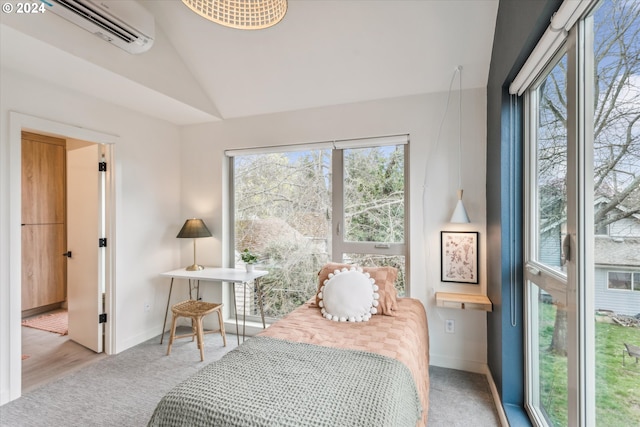 carpeted bedroom with lofted ceiling and an AC wall unit