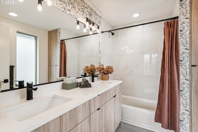 bathroom with shower / bath combo and vanity