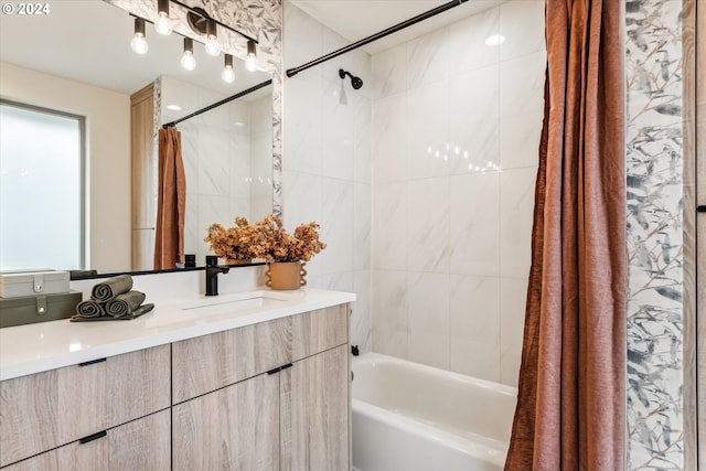 bathroom featuring vanity and shower / bath combo with shower curtain