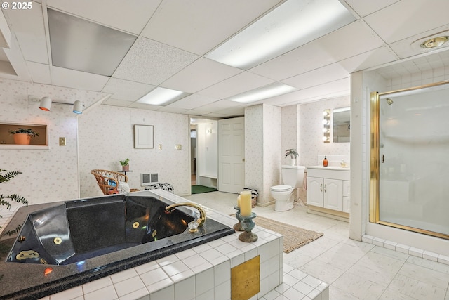 bathroom featuring visible vents, vanity, a tub with jets, wallpapered walls, and a stall shower