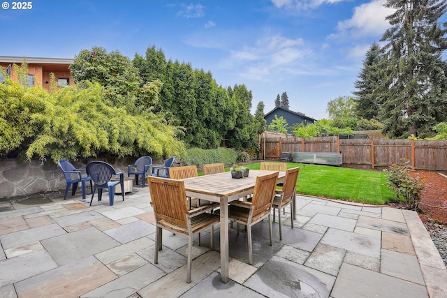 view of patio with a fenced backyard and outdoor dining area