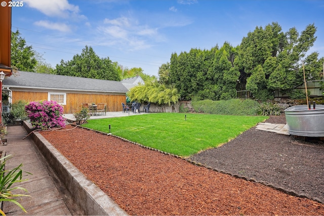 view of yard with fence and a patio area