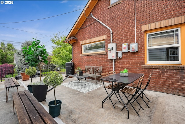 view of patio / terrace featuring fence