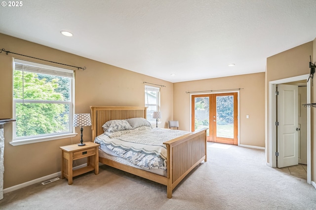 26250 S Milk Creek Cir, Mulino, OR 97042 - bedroom with french doors, access to exterior, light carpet, multiple windows, and recessed lighting